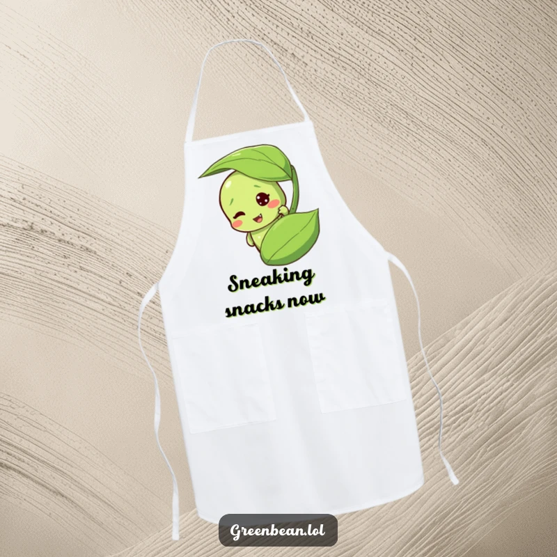 Funny green bean apron with a mischievous character peeking from behind a leaf. A humorous cooking accessory.