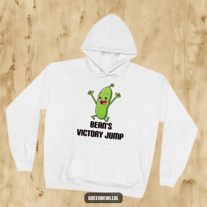 Funny Hoodie showing a determined green bean character in a triumphant leap, offering cozy warmth and celebration humor, an excellent funny gift.