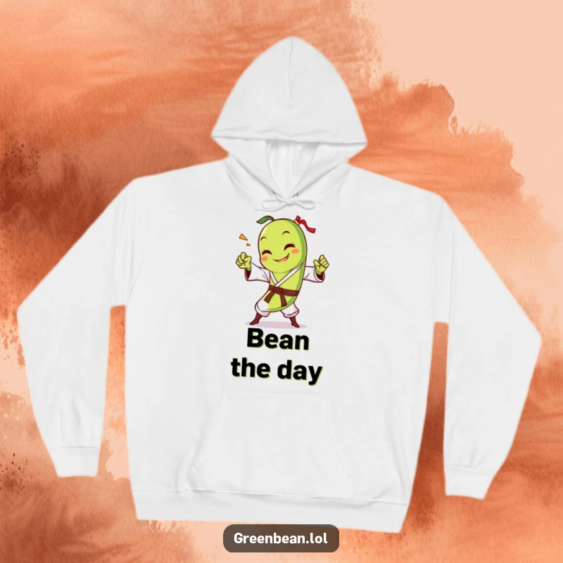 Funny green bean hoodie featuring a smiling character executing a powerful karate chop, offering warmth and hilarious veggie-themed fun. Super soft.